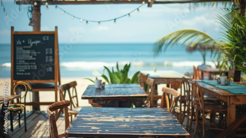 A seaside cafe or restaurant with outdoor seating and waterfront views, leaving space on the menu board or chalkboard for showcasing summer specials or promotions. 