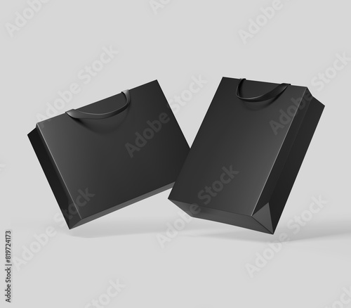 Black shopping bag for branding with place for your brand name or text, Mockup, 3d rendering, isolated on light background.