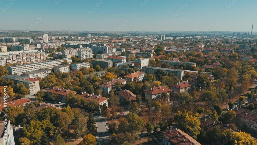 Drone flying over the cityscape of Dimitrovgrad on a sunny day with blue sky in Bulgaria Drone flying over the cityscape of Dimitrovgrad on a sunny day with blue sky in Bulgaria