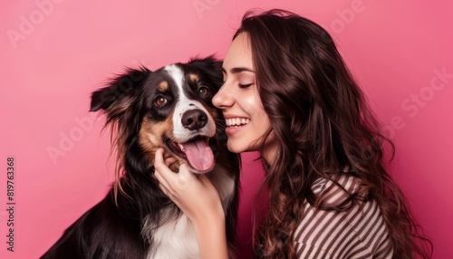 Happy Woman with Her Dog Against Pink Background.. photo