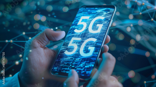 A person is holding a cell phone with the word 5G on it. The image has a futuristic and technological vibe, with the phone being the main focus photo