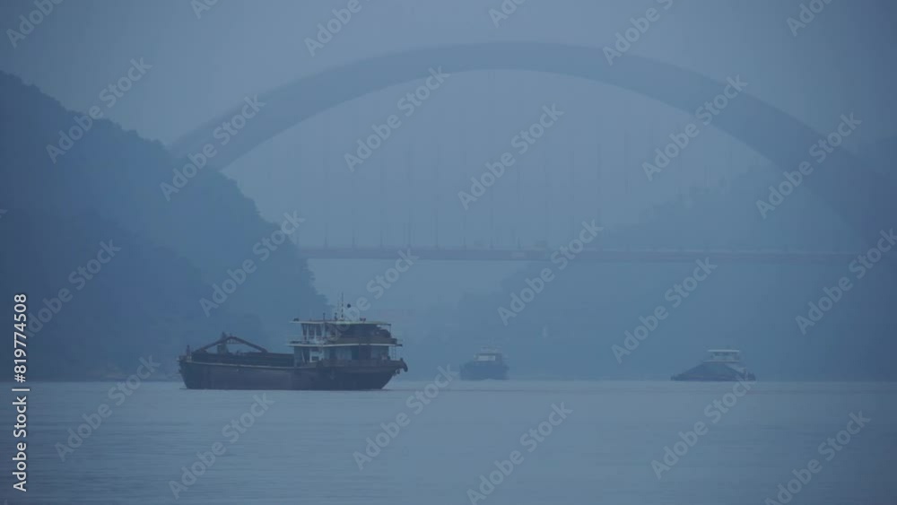 Aerial view boat sailing on river surrounded by dense trees Aerial view boat sailing on river surrounded by dense trees
