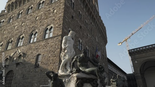 Fountain of Neptune in front of the Palazzo Vecchio in the Piazza della Signoria in Florence, Italy photo