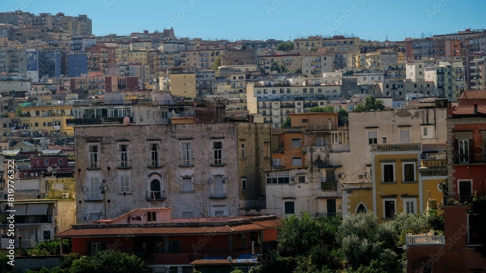 View of city full of colorful buildings under the blue sky. View of city full of colorful buildings under the blue sky.