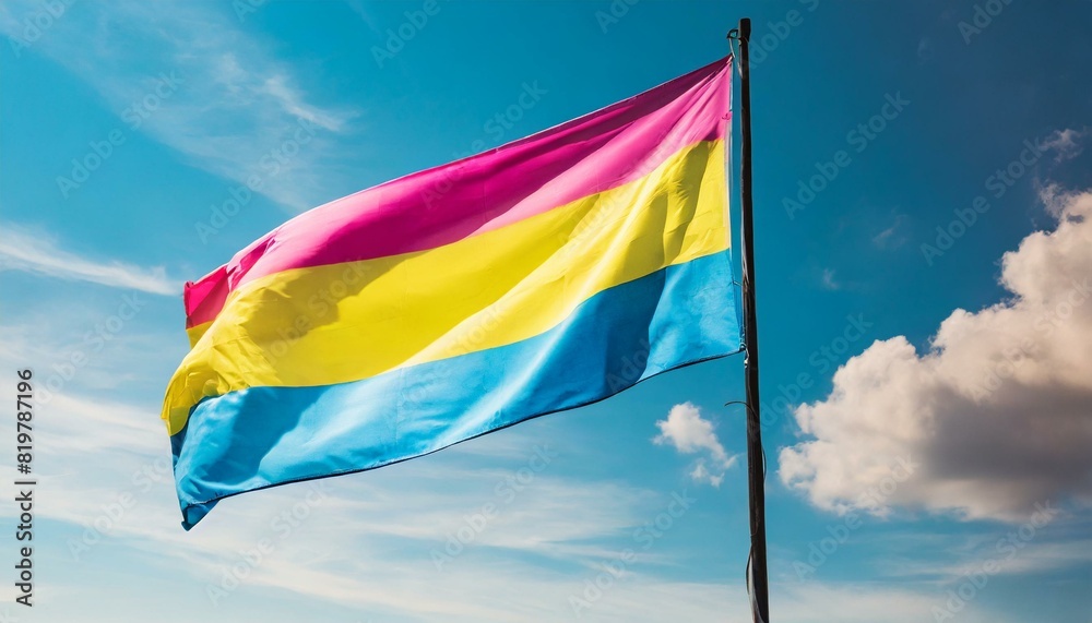 pansexual flag flutters against blue sky, lgbtq pride month pansexual flag flutters against blue sky, lgbtq pride month