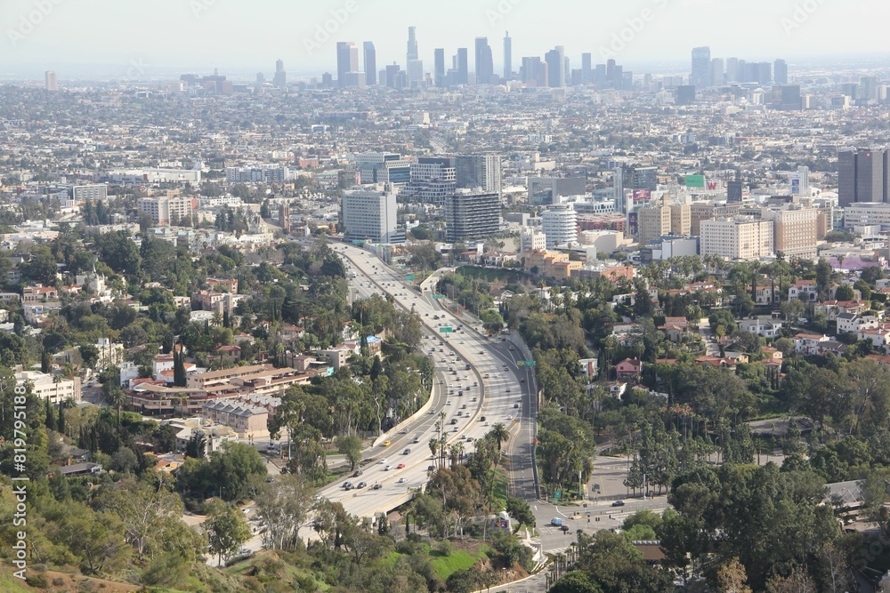 Scenic shot of a vibrant cityscape of Los Angeles, California, USA from the top of a tall mountain Scenic shot of a vibrant cityscape of Los Angeles, California, USA from the top of a tall mountain