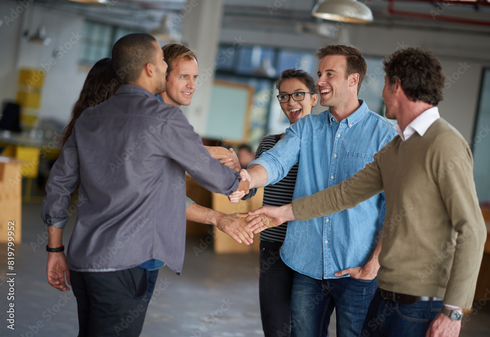 Fototapeta premium Business people, handshake and group with meeting at startup for collaboration, b2b deal or agreement. Men, women and shaking hands with smile in scrum, kindness and respect at creative media agency