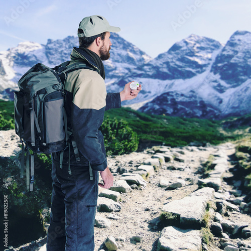 Man, hiking and compass on mountain to guide, outdoor nature and trekking challenge or adventure. Male person, explore and equipment for navigation or route direction, exercise and lost on journey