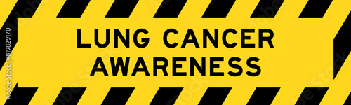 Yellow and black color with line striped label banner with word lung cancer awareness