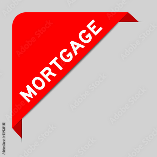 Red color of corner label banner with word mortgage on gray background