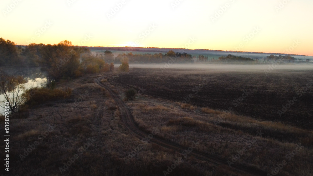 An empty plowed field in autumn at dawn An empty plowed field in autumn at dawn