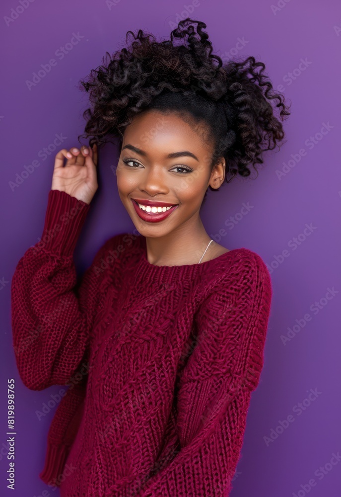 A lovely and cheerful woman showcases her impeccable style and beauty against a rich purple background, exuding confidence and sophistication. A lovely and cheerful woman showcases her impeccable style and beauty against a rich purple background, exuding confidence and sophistication.