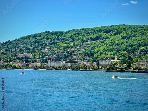 Scenic View of Stresa on Lake Maggiore with Lush Green Hills and Waterfront Buildings in Verbano-Cusio-Ossola, Piedmont, Italy