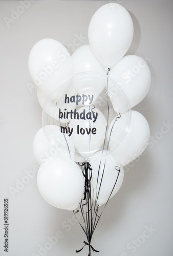 white balloons with black ribbons, bubbles balloon with the inscription photo