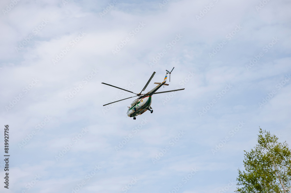 Ukrainian medical helicopter flying in the sky, conducting a rescue operation, helping people. Photography, war in Ukraine, air ambulance. Ukrainian medical helicopter flying in the sky, conducting a rescue operation, helping people. Photography, war in Ukraine, air ambulance.