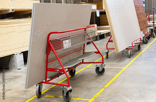 Fordable platform hand truck with cardboard box. goods sale. commerce, post box online shopping. Purchasing power, delivery order. E-commerce, sales and sale of goods through online trading platforms.