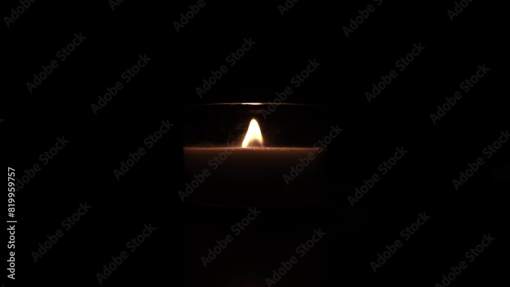 Candle light in the dark in church. Flickering Candle. Spiritual Atmosphere Candle light in the dark in church. Flickering Candle. Spiritual Atmosphere
