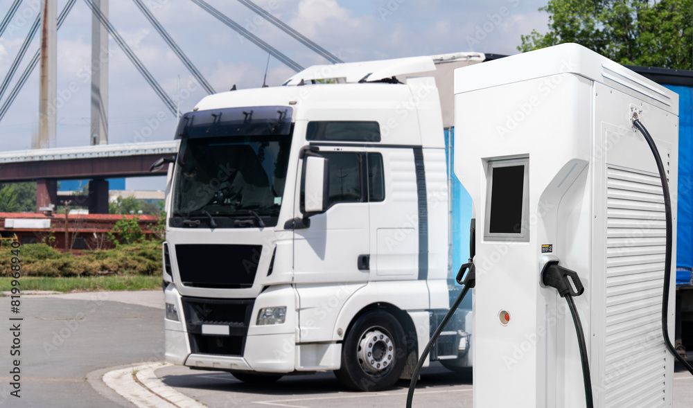 Electric vehicles charging station on a background of a truck. Concept.. Electric vehicles charging station on a background of a truck. Concept..