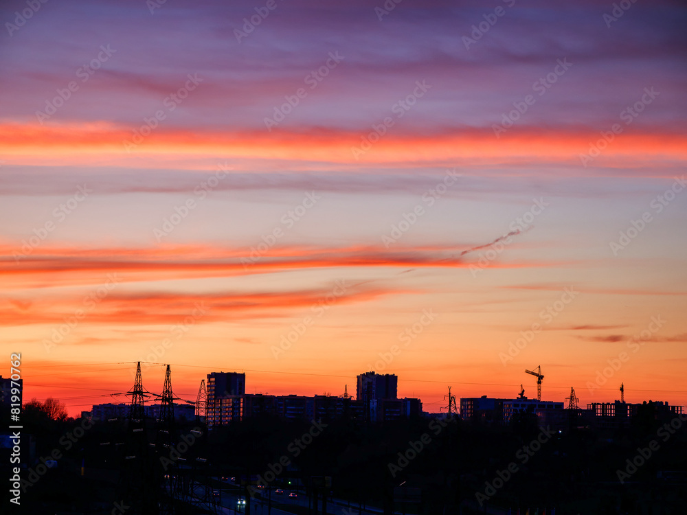 Urban silhouette against vibrant dusk, ideal for travel and calming visuals.