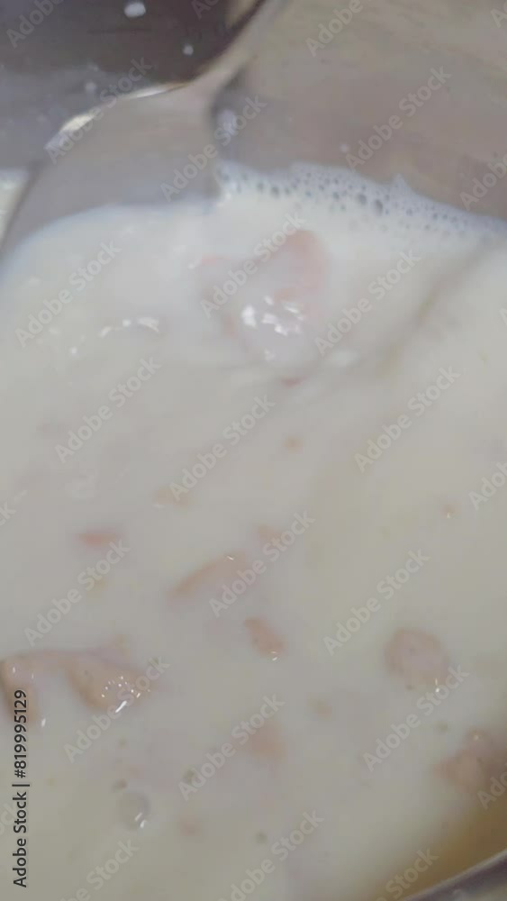 Stir, add live yeast to the milk, knead the dough for baking. Vertical video Stir, add live yeast to the milk, knead the dough for baking. Vertical video