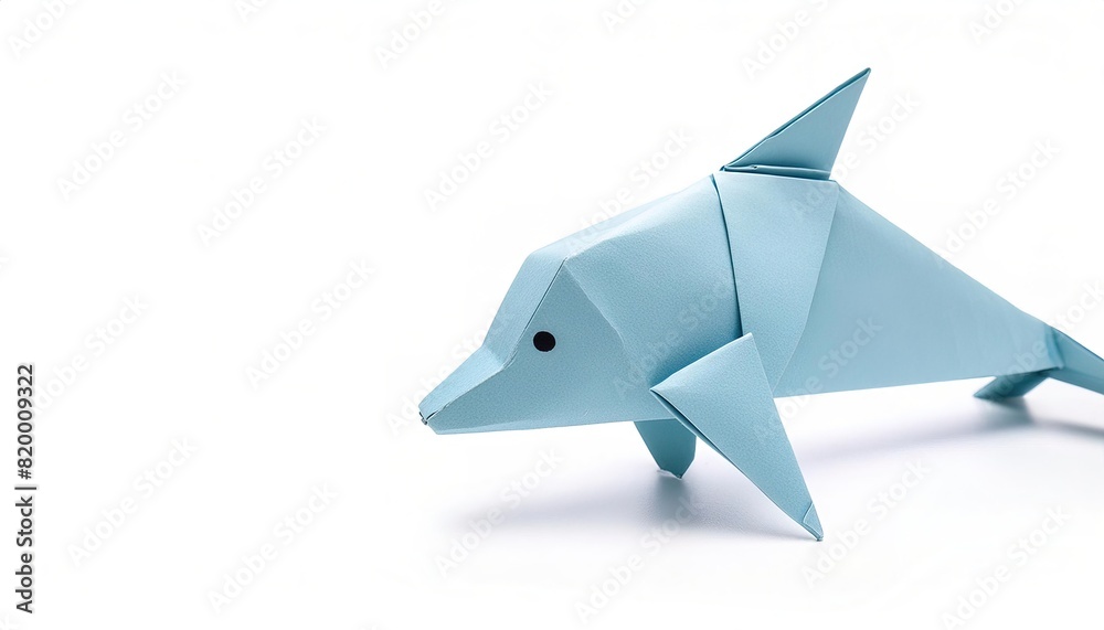 Animal concept origami isolated on white background of a bottle nose dolphin porpoise - Tursiops truncates - with copy space side view of fins, tail, face, simple starter craft for kids Animal concept origami isolated on white background of a bottle nose dolphin porpoise - Tursiops truncates - with copy space side view of fins, tail, face, simple starter craft for kids