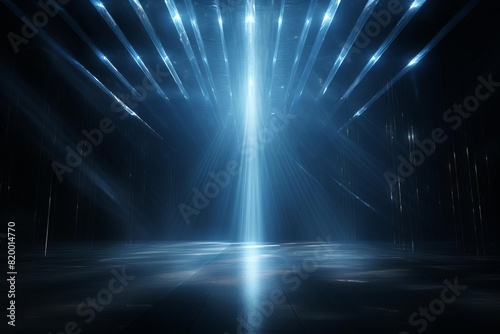 Blue light beams shining down in a dark room