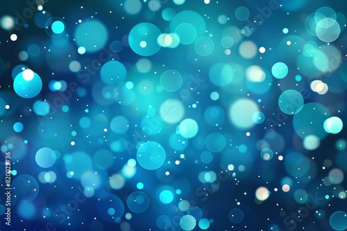 Abstract blue bokeh background with glowing light circles creating a dreamy, festive atmosphere perfect for holiday and celebration themes.