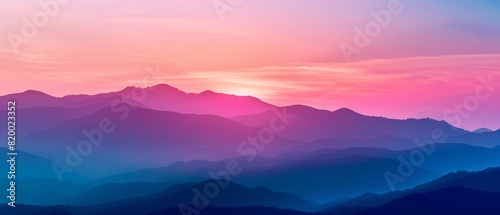 Breathtaking view of colorful mountains during sunrise, showcasing layers of hills with hues of pink, purple, and blue under a serene sky.