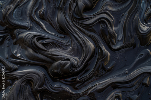 The photo is a close up of a black, wavy line