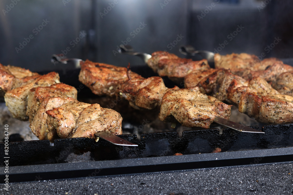 Kebabs on skewers close up Food court at the fair outdoor cooking