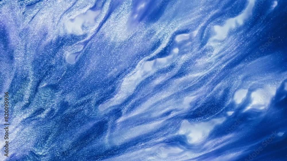 Fluid art drawing video, abstract acrylic texture with flowing effect. Liquid paint backdrop with chaotic waves and swirls. Artistic background motion with glitter and blue overflowing colors.