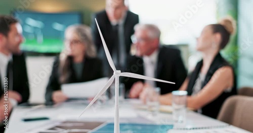 Windmill, model and meeting for sustainability with people, negotiation and legal documents for planning. Engineer, lawyer and contractor with discussion for renewable energy, environment or ecology