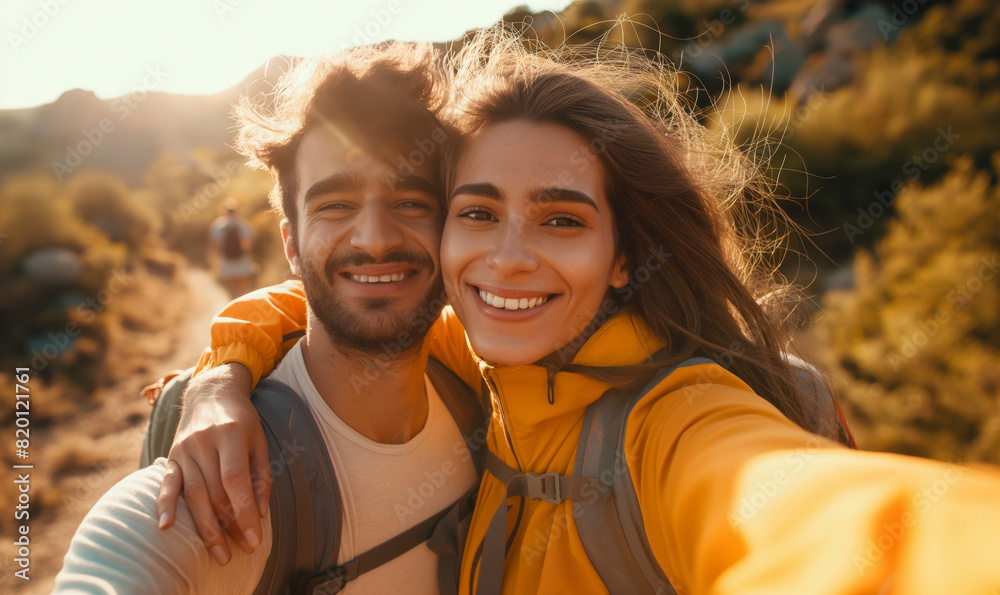 A young couple takes a selfie. Selfie against the backdrop of nature. Autumn nature in the background.