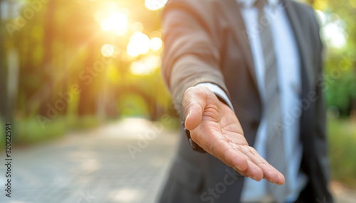 Man in a suit helping hand gesture © The Stock Photo Girl