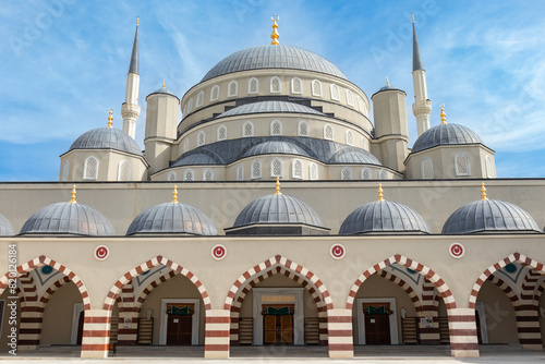 A beautiful front view of its dome from the outside of the 18 March Hatime Ana Grand Mosque in Canakkale. Architectural details in its dome. photo