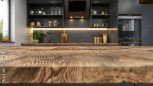 Wooden light empty countertop on the background of a modern dark gray kitchen, kitchen panel with accessories in the interior. Scene showcase template for promotional items, banner, copy space