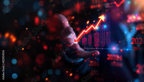 Businessman holding rising arrow hologram with glowing chart. Concept of business growth, financial success, and technological innovation. photo