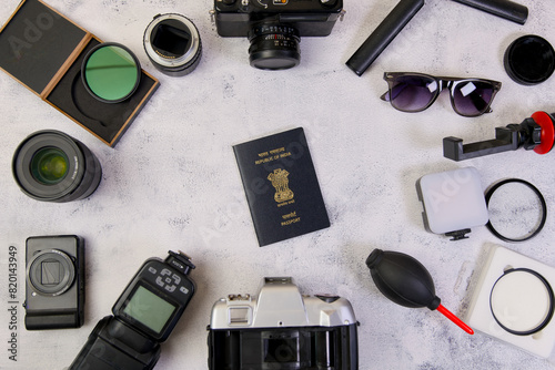Indian Passport camera magnifying glass and other equipment on a white background