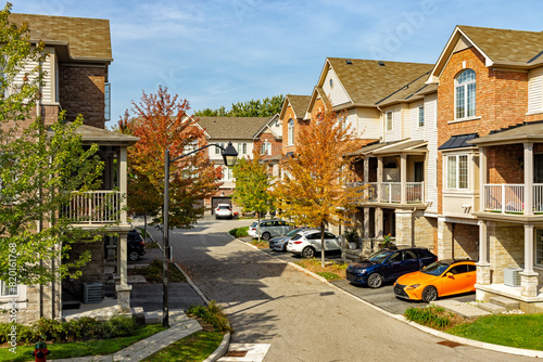Residential townhouses. Modern apartment buildings in Ontario, Canada. Real estate development, street photo.