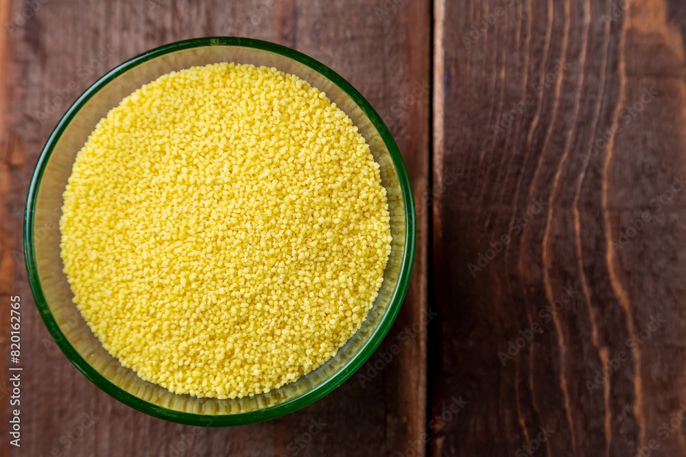 crumbly couscous cereal in a glass bowl on the table crumbly couscous cereal in a glass bowl on the table