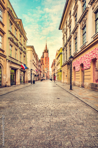 Old town street in Cracow  Poland with St. Mary s Basilica