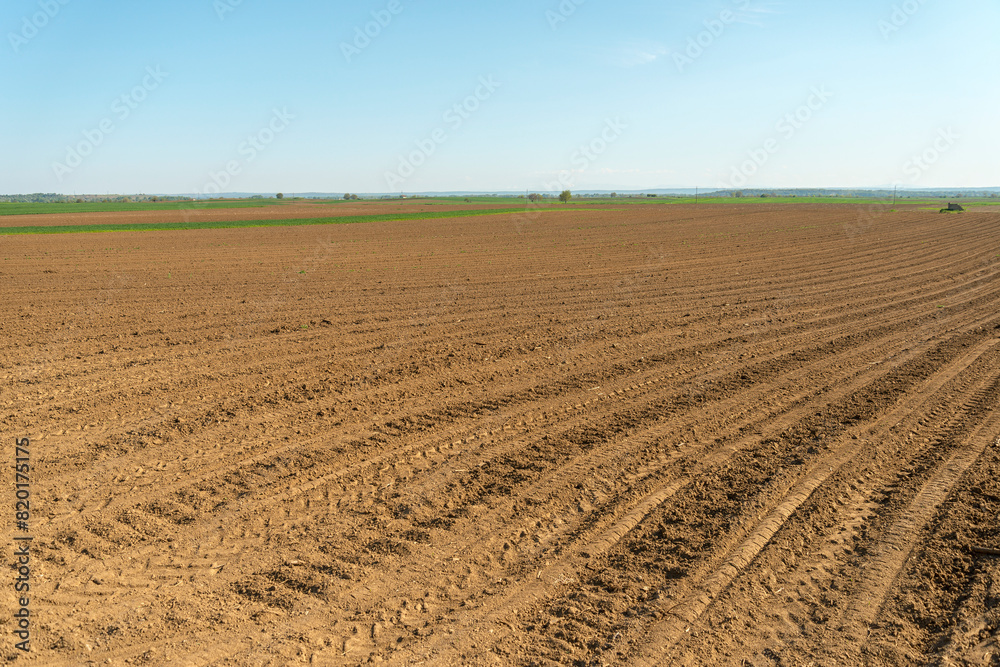 Sky over agricultural fields, meadow, soil Sky over agricultural fields, meadow, soil