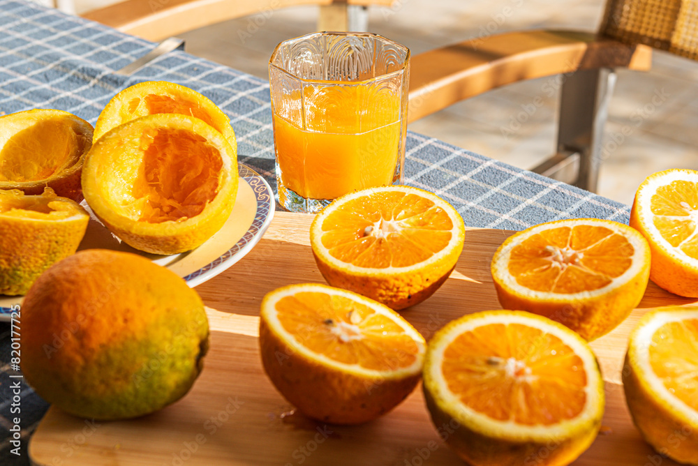 Large greek oranges, halved and ready to be squeezed for some golden, delicious juice. Large greek oranges, halved and ready to be squeezed for some golden, delicious juice.