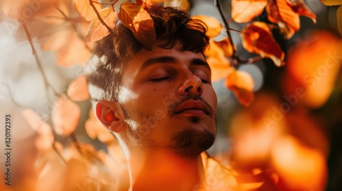 A man standing under a tree with his eyes closed