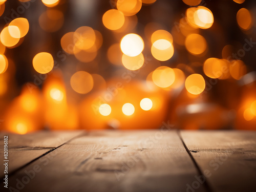 Warm bokeh lights cast an orange hue on a wooden backdrop