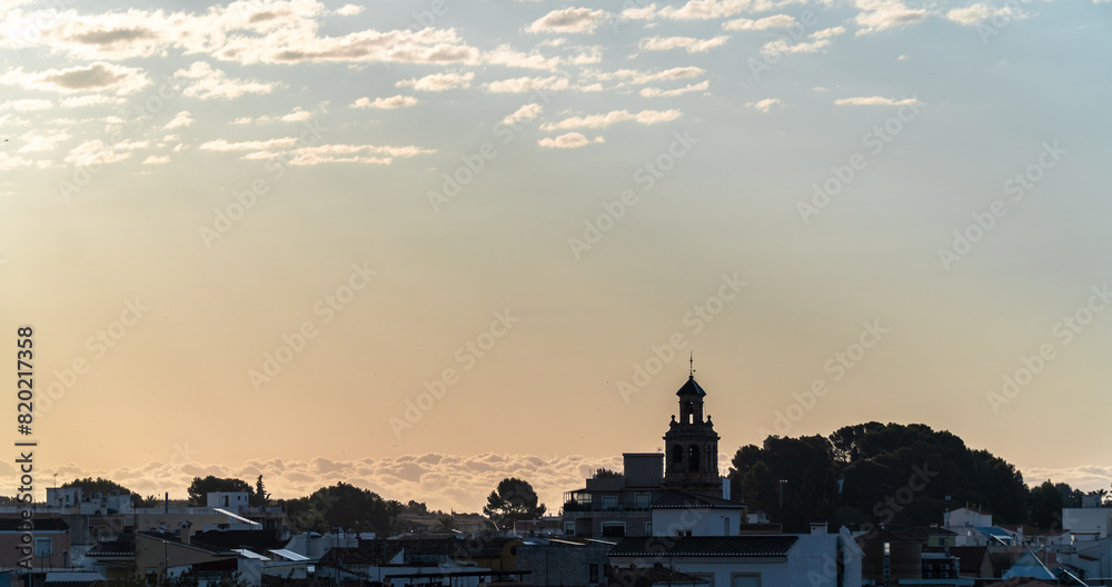 Landscape, town shillouette in the morning, on a clear sky.