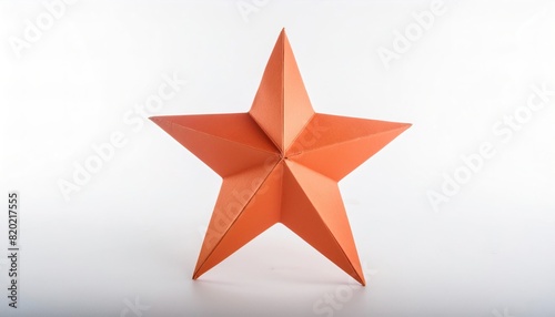 Christmas holiday or astrological concept paper origami isolated on white background of a star like the ones that go on top of a Christmas tree  with copy space  simple starter craft for kids