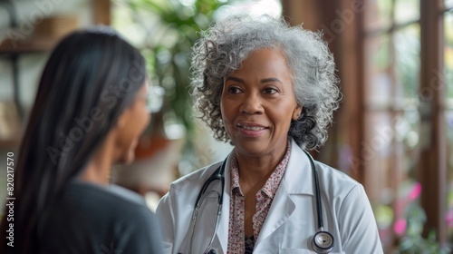 cultural compassion, an indian oncologist discussing treatment with a black elderly woman, offering comfort and empathy in a heart-to-heart conversation