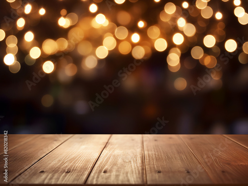 Soft focus on wooden table, adorned with glowing lights, ideal for text