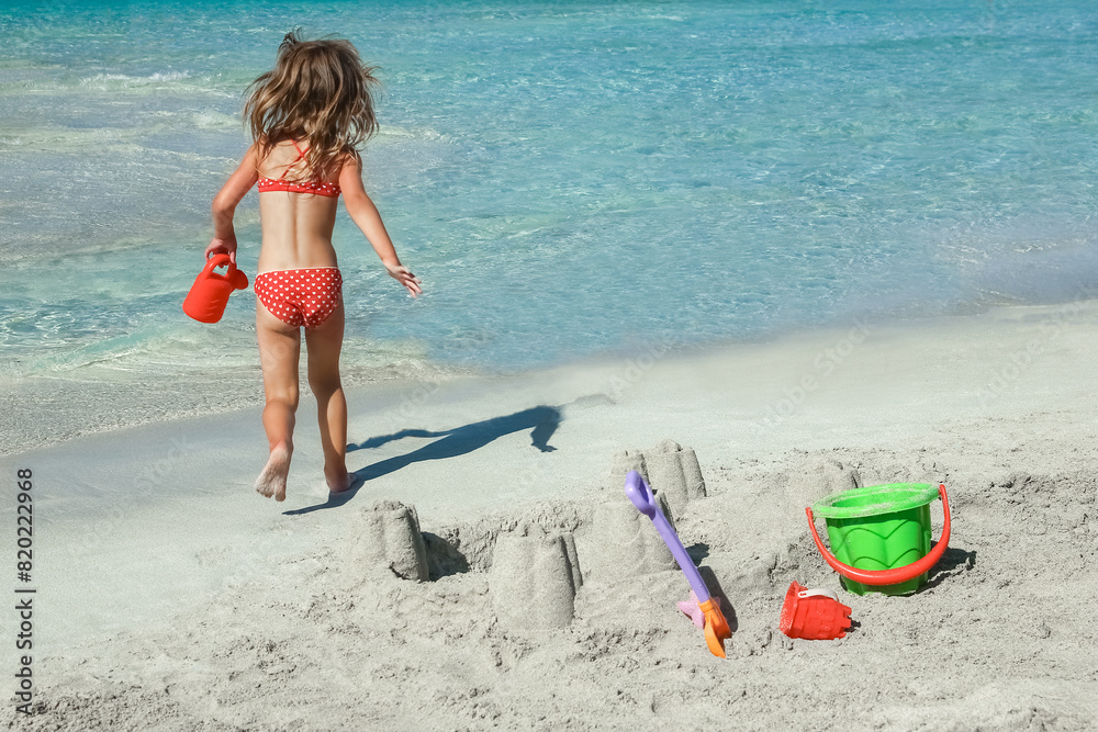 happy child playing by the sea outdoors happy child playing by the sea outdoors